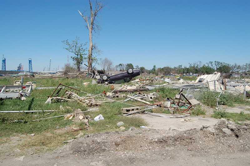 New Orleans 04-08-06 041.JPG - This area, adjacent to the east bank of the Industrial Canal, was hit hardest.  Most houses were swept away by water pouring through breaches in the levees.   Cranes in the background are working on repairing levees in anticipation of the 2006 hurricane season.